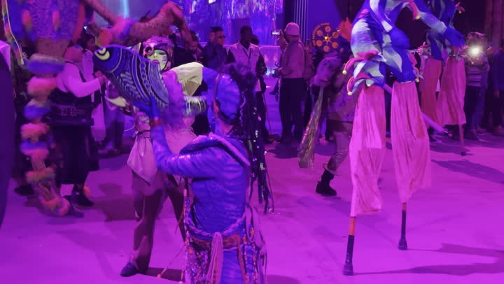 Illuminated characters in a theatrical performance on the platform of the Middle Beast Festival on December 13, 2025, in the Kingdom of Saudi Arabia, a gathering of the public enjoying the shows, a festive night atmosphere, Middle Beast celebrations in Banban, Riyadh, entertainment and amusement for the Saudi people during the Riyadh season.