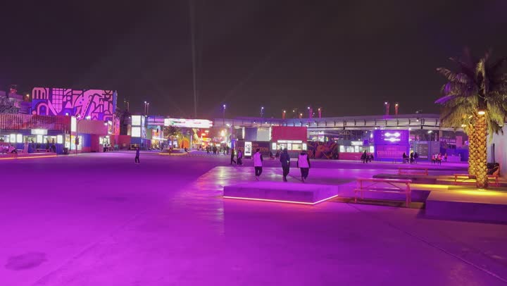 Night atmosphere in the outdoor activities area, Soundstorm Middle Beast Festival in the Binban area of Riyadh, December 13, 2025, in the Kingdom of Saudi Arabia, strong purple lighting extending over the open path, visitors wandering in a fun and entertaining atmosphere, a delightful family and youth experience as part of the Riyadh Season events.