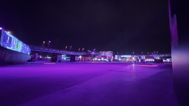 Night atmosphere in the outdoor activities area, Soundstorm Middle Beast Festival in the Binban area of Riyadh, December 13, 2025, in the Kingdom of Saudi Arabia, strong purple lighting extending over the open path, visitors wandering in a fun and entertaining atmosphere, a delightful family and youth experience as part of the Riyadh Season events.