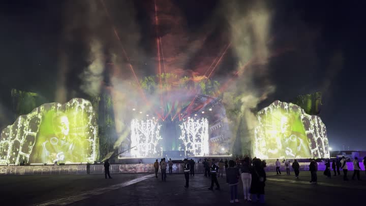 A modern global music festival on December 13, 2025, in the Kingdom of Saudi Arabia, featuring a projection of a bright electronic screen in the celebration area of the Middle Beast in Banban, Riyadh, providing entertainment and amusement for the Saudi people during the Riyadh season.