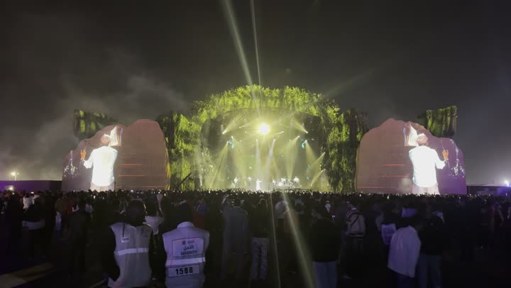 A modern global music festival on December 13, 2025, in the Kingdom of Saudi Arabia, featuring a projection of a bright electronic screen in the Middle Beast celebration area in Banban, Riyadh, providing entertainment and amusement for the Saudi people during the Riyadh season.