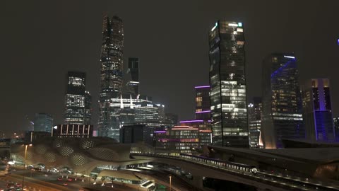 Aerial drone photography of the King Abdullah Financial District (KAFD), famous landmarks of Riyadh, the illuminated financial and economic towers in the city of Riyadh, the architectural engineering art of the towers and skyscrapers in the Kingdom of Saudi Arabia, famous places and landmarks.