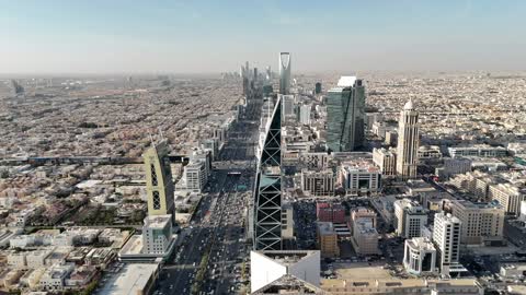 Aerial drone photography of the Kingdom Centre and Al Faisaliah Tower, the architectural engineering art of towers and skyscrapers in the Kingdom of Saudi Arabia, famous landmarks of Riyadh, places and notable attractions.