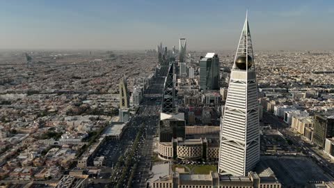 Aerial drone photography of the Kingdom Centre and Al Faisaliah Tower, the architectural engineering art of towers and skyscrapers in the Kingdom of Saudi Arabia, famous landmarks of Riyadh, places and notable attractions.