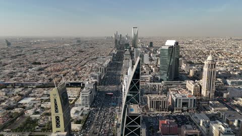 Aerial drone photography of the Kingdom Centre and Al Faisaliah Tower, famous landmarks of Riyadh, the architectural engineering art of towers and skyscrapers in the Kingdom of Saudi Arabia, famous places and landmarks.