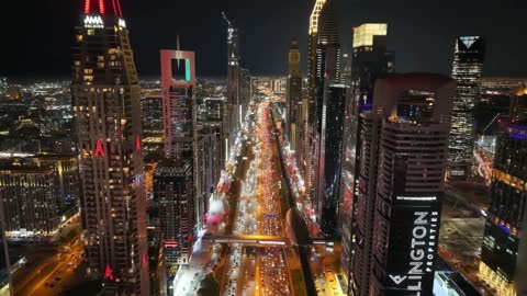 The architectural engineering art of buildings and structures in the United Arab Emirates, the growth and urban development of towers and skyscrapers on Sheikh Zayed Road in Dubai, famous tourist landmarks in Dubai, the tallest towers in the world, Burj Khalifa.