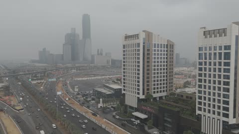 Mövenpick Hotel in Riyadh, Saudi Arabia, the overcast sky and clouds, the towers and skyscrapers, architectural art, the famous towers, landmarks, and roads of Riyadh.