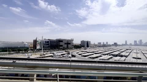 The architectural engineering art of companies in Saudi Arabia, panoramic photography from the metro of Riyadh, urban progress and development, infrastructure of highways and traffic, towers and skyscrapers, famous landmarks of Riyadh.