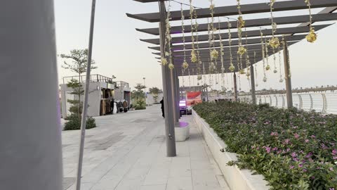 Cafes and seating areas in front of the tourist waterfront during the events of the Wonders Hills Festival 2025 in the city of Jubail Industrial in the Eastern Province, Jubail Corniche, innovative interactive light shows, various entertainment activities, famous tourist attractions.