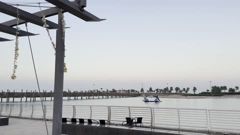 Cafes and seating areas in front of the tourist waterfront during the events of the Wonders Hills Festival 2025 in the city of Jubail Industrial in the Eastern Province, Jubail Corniche, innovative interactive light shows, various entertainment activities, famous tourist attractions.