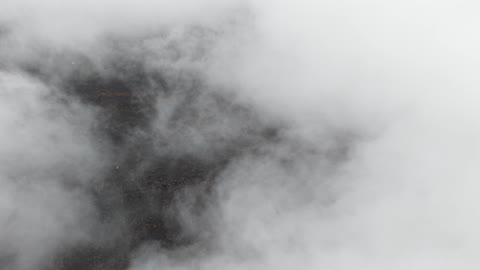 The winter foggy weather above the mountain in the sky of the city of Hura Tabuk in the Kingdom of Saudi Arabia, hail (small snowflakes) fell over the volcanic fields in Tabuk.