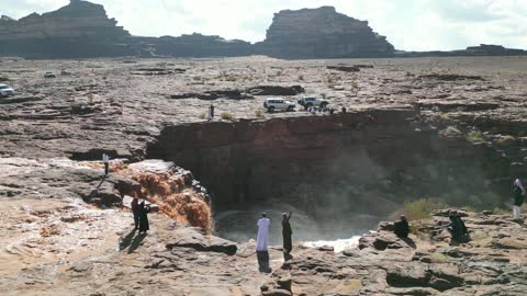 The Shalal Al-Shaq is located in the west of Tabuk city in the Kingdom of Saudi Arabia, where the stream flows after heavy rainfall. It features mountains, desert, and coastline, making it a landmark and a tourist area, showcasing the nature of Tabuk.