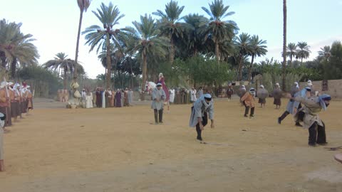 Showcasing the life journey of the Babylonian king, the Mamalik event in the province of Tayma, the royal history of the ancient city of Tayma, the festival of ancient kingdoms, presenting a theatrical performance, preserving the historical heritage, wearing traditional old attire.