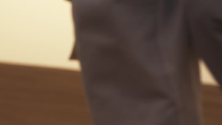 The beauty of the Emirati nature, the soft golden sands in the deserts of the United Arab Emirates, a man walking over the golden sand dunes in one of the desert areas, a view of the stormy sand dunes deep in the Abu Dhabi desert.