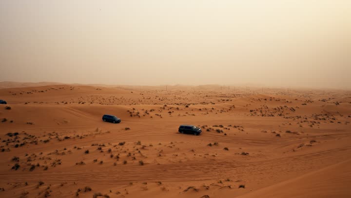 Enjoying favorite hobbies, an exciting adventure on the soft golden sands in the deserts of the United Arab Emirates, safari adventures on the sand dunes, Toyota Land Cruisers in the Dubai desert, fun desert activities.