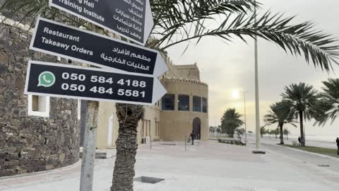 Visitors and photographers gathered in front of the Heritage Village in Dammam on December 29, 2025, Saudi Arabia, for a heritage event with an authentic folk character. The Global Village in Dammam offers a cultural and tourist experience for families and visitors, showcasing the authenticity of Saudi architectural heritage.