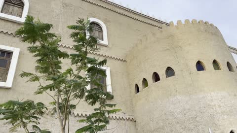 The trees and green plants surrounding the folk village in the city of Dammam on December 29, 2025, the Global Village in Dammam, Saudi architectural heritage, a prominent cultural and tourist destination in the Kingdom of Saudi Arabia, a heritage event with an authentic folk character.