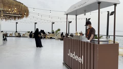 A kiosk specialized in offering various drinks and foods, a collection of restaurants and cafes overlooking the sea, the tourist waterfront in the Kingdom of Saudi Arabia in the city of Jubail Industrial, Jubail Corniche, famous tourist attractions.