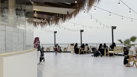 A café specialized in offering various drinks and foods, a collection of restaurants and cafés overlooking the sea, the tourist waterfront in the Kingdom of Saudi Arabia in the city of Jubail Industrial, Jubail Corniche, famous tourist attractions.