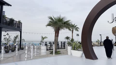 A café in an outdoor location on the beach, a group of restaurants and cafes overlooking the sea, the tourist waterfront in the Kingdom of Saudi Arabia in the city of Jubail Industrial, Jubail Corniche, famous tourist attractions.
