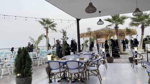 Tables and chairs designed from bamboo, the tourist waterfront in the Kingdom of Saudi Arabia in the city of Jubail Industrial on December 28, 2025, a collection of restaurants and cafes overlooking the sea, Jubail Corniche, famous tourist attractions.