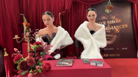 Use of an electronic screen, an interactive fashion show at the Designers' Exhibition in the Eastern Province on December 29, 2025, Saudi Arabia, highlighting identity and innovation, direct interaction with visitors, a creative platform for fashion and design, and an upscale atmosphere inside the exhibition.