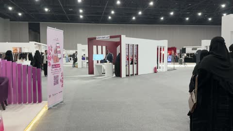 Highlighting identity and innovation, diverse pavilions at the Designers and Designresses Exhibition in the Eastern Province on December 29, 2025, Saudi Arabia, direct interaction with visitors, a creative platform for fashion and design, upscale atmosphere inside the exhibition.