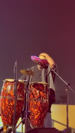 A man on stage in traditional mariachi hat attire playing the guitar, the Ithra Food Festival from December 22 to January 1, 2026, a Mexican folk dance, King Abdulaziz Center for World Culture (Ithra) in Dhahran, Saudi Arabia, a unique design resembling gravel.