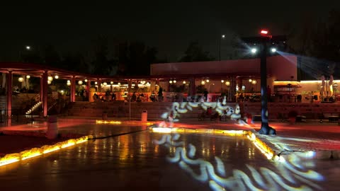 Selling local products, various stalls and restaurants, a quiet outdoor seating area at the winter bazaar at night in the Diplomatic Quarter in Riyadh from December 11, 2025, to January 3, 2026, a warm family winter atmosphere, a unique winter shopping experience that combines handicrafts.