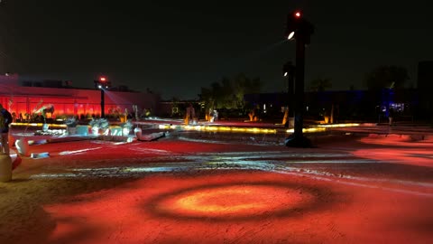 Selling local products, various stalls and restaurants, a quiet outdoor seating area at the winter bazaar at night in the Diplomatic Quarter in Riyadh from December 11, 2025, to January 3, 2026, a warm family winter atmosphere, a unique winter shopping experience that combines handicrafts.