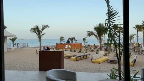 Seaside seating, events and recreational activities, the sea at the Corniche of Khobar in the Eastern Province, Kingdom of Saudi Arabia, tourist restaurants and cafes, a calm atmosphere and a pleasant relaxation experience, a family-friendly coastal beach destination.