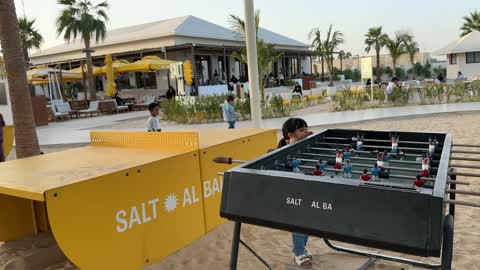 Recreational activities and events at Salt Beach on the Corniche in Al Khobar, Eastern Province, Saudi Arabia, with sea-view seating, a family-friendly coastal beach destination, a calm atmosphere, and a pleasant relaxation experience, as well as tourist restaurants and cafes.