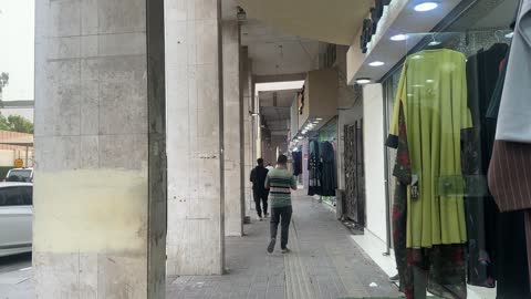 Clothes and abayas in the Love Market in Dammam, Eastern Province, Saudi Arabia, cultural heritage and traditional trade, shops and local commercial goods, various food stalls.