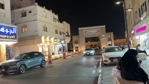 Traffic and cars in the Love Market in Dammam, Eastern Province, Saudi Arabia, cultural heritage and traditional trade, shops and local commercial goods, various food stalls.