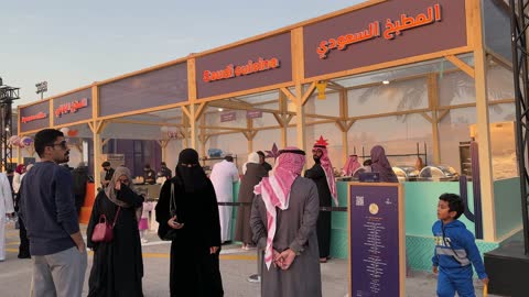 International and local restaurants at a food festival in the Ithra outdoor gardens in Dhahran, Eastern Province, Saudi Arabia, on December 28, 2025, enjoyable outdoor seating, global dining experience, family-friendly and entertaining atmosphere.