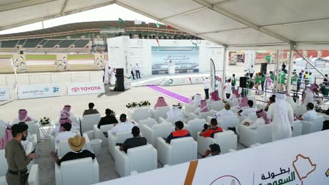 Rally race event in the Kingdom of Saudi Arabia, the championship and sports activities in the city of Tabuk, car speed race, preparing the venue for enjoyable recreational youth sports, competition and rivalry to achieve victory, the turns and directions for the competing cars.