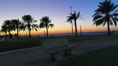 A coastal promenade with outdoor seating, the waterfront in Dammam city, Eastern Province, Saudi Arabia, offers various recreational and sports activities, restaurants and cafes overlooking the sea, a tourist and entertainment landmark open to the Arabian Gulf, with a calm and unique family atmosphere.