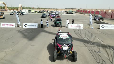 A prominent local sports event in the Kingdom, a competition with diverse terrains in Tabuk, the rally race event in the Kingdom of Saudi Arabia, car speed racing, preparing the venue for enjoyable recreational youth sports, the turns and directions for the competing cars.