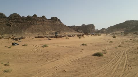 Events in Saudi motorsports, a competition with diverse terrains in Tabuk, a rally race event in the Kingdom of Saudi Arabia, car speed racing, preparing the venue for enjoyable youth recreational sports, the turns and directions for the competing cars.