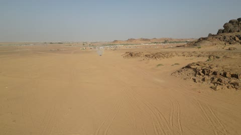 Events in Saudi motorsports, a competition with diverse terrains in Tabuk, a rally race event in the Kingdom of Saudi Arabia, car speed racing, preparing the venue for enjoyable youth recreational sports, the turns and directions for the competing cars.