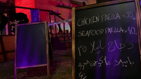 Spanish food restaurants and cafes, the Spanish neighborhood event at the King Abdulaziz Center for World Culture "Ithra" in Dhahran, Eastern Province, Saudi Arabia, on January 13, 2026, a vibrant festive atmosphere, a complete cultural and entertainment experience inspired by Spanish character, flamenco dances, and interactive activities.