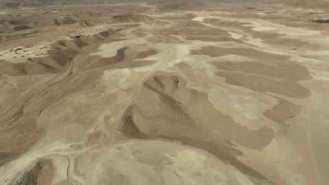 The landscapes and soft golden sands in the desert, the soft golden dunes and natural terrain in the Kingdom of Saudi Arabia, rock formations in the Saudi Arabian desert, spending time in the desert with friends, nature background.