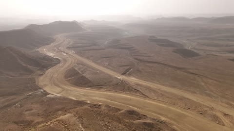 Mountains of rock formations in the desert, the landscapes and soft golden sands in the desert, the soft golden dunes and natural terrain in the Kingdom of Saudi Arabia, rock formations in the Saudi Arabian desert, nature background.