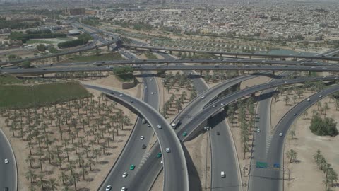 Bridges and ramps connect the roads, urban growth and development, the famous roads, streets, and landmarks of Riyadh, the traffic of cars, the towers and skyscrapers in the city of Riyadh in the Kingdom of Saudi Arabia, architectural engineering art.