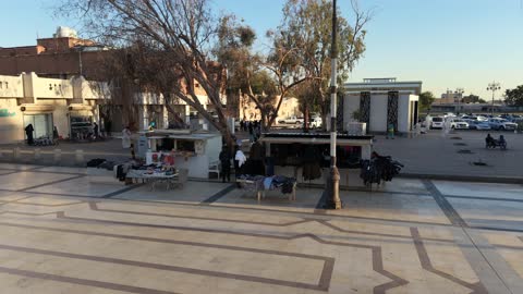 Men's clothing display and sales, with services and facilities for restrooms and parking available. The market combines authenticity and heritage, showcasing the public market in Tabuk, Saudi Arabia. A variety of stores and reasonable prices, providing everything a visitor needs.