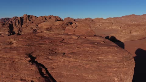 A luxurious mountain tourist destination, a global center for winter sports and adventures, drone photography of the towering mountains with rock formations in the Tabuk region, Tabuk Desert in Neom, northwest of the Kingdom of Saudi Arabia.