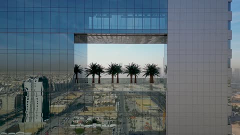 A landmark and famous place in the Kingdom of Saudi Arabia, the financial and economic towers and commercial establishments, the architectural engineering art of buildings and skyscrapers in a modern style, urban development and civilizational progress, drone photography of the financial center in Riyadh.