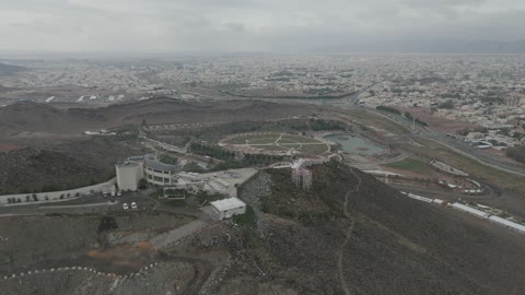A destination that combines entertainment, heritage, and nature, a drone shot of the viewpoint of Hatim Al-Tai on Jabal Al-Samra in Hail, a historical landmark that celebrates Arab generosity and the spirit of hospitality.