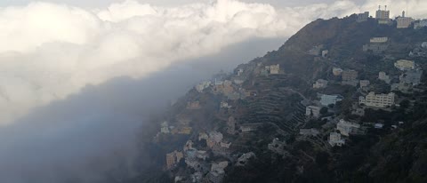 Natural tourist places and landmarks, trees and plants and areas of green nature, agricultural terraces on the mountain slopes, the Jebel Fayfa mountains in Jazan in the south of the Kingdom of Saudi Arabia, peaks and rocky elevations, houses and residential buildings.