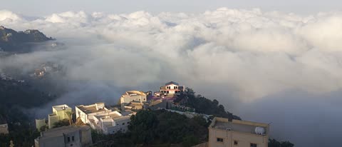 Natural tourist places and landmarks, trees and plants and areas of green nature, agricultural terraces on the mountain slopes, the Jebel Fayfa mountains in Jazan in the south of the Kingdom of Saudi Arabia, peaks and rocky elevations, houses and residential buildings.